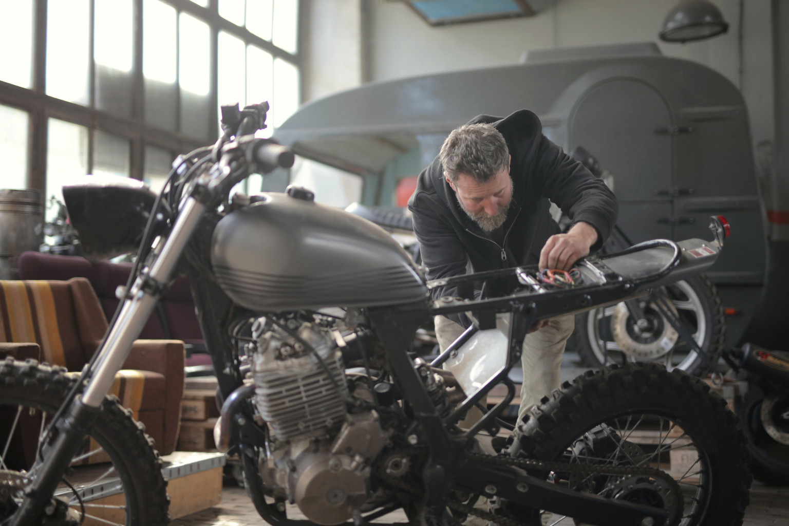 Guy Fixing Motorcycle