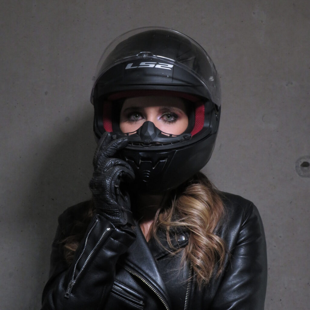 Woman With MotorcycleHelmet On